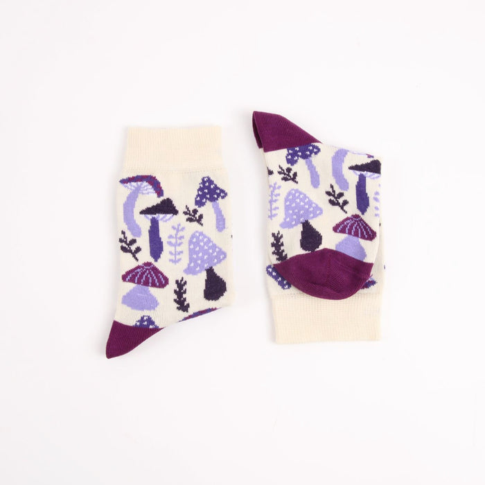 Pair of socks with purple and black abstract design on a white background