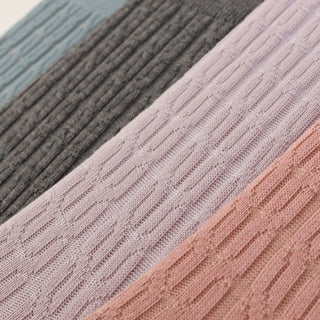 Close-up of textured fabric swatches in various colors.