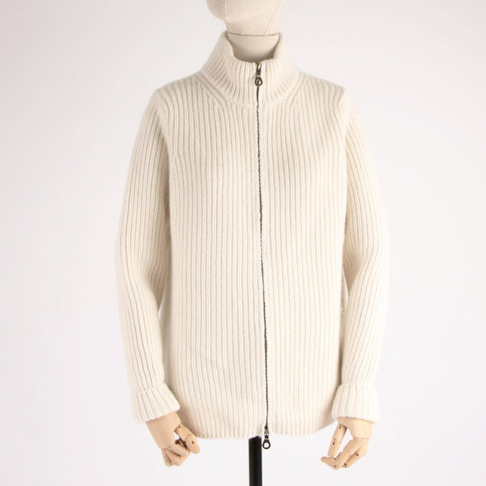 White ribbed knit cardigan on a mannequin against a white background