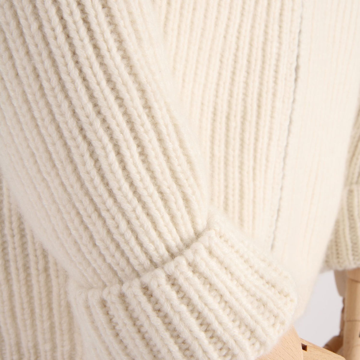 Close-up of white rib knitted sleeve