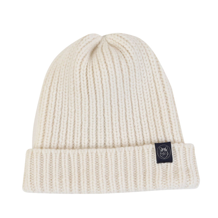 An ecru unisex wool beanie with a ribbed knit texture and a small branded tag on the brim.