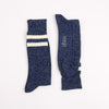 Pair of blue socks with white stripes on a white background