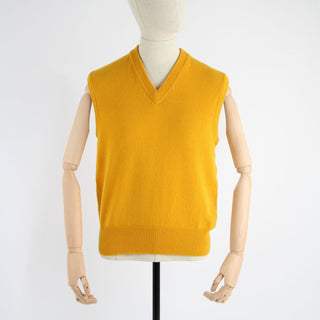 A yellow men's V-neck sleeveless sweater displayed on a mannequin.