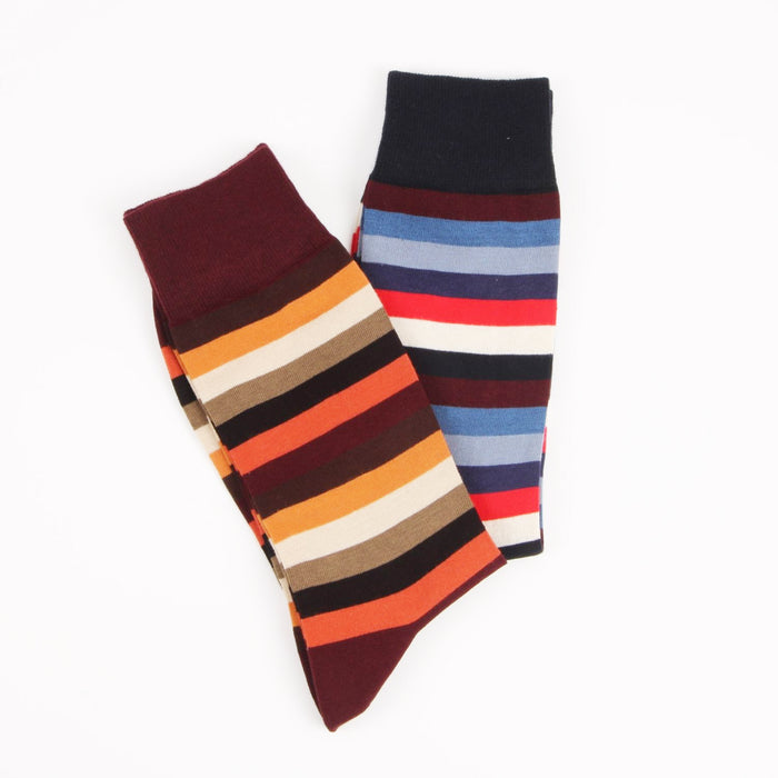 Two pairs of striped socks on a white background