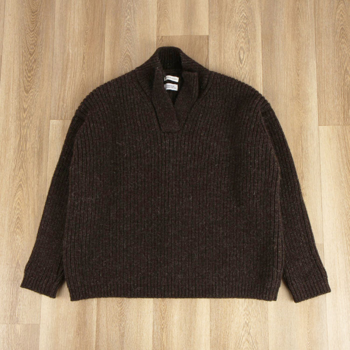 Brown sweater on a wooden surface