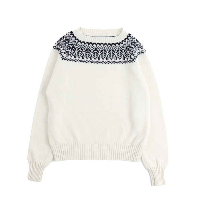 White sweater with navy patterned collar on a white background