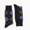 Pair of navy argyle socks with purple and green pattern on a white background