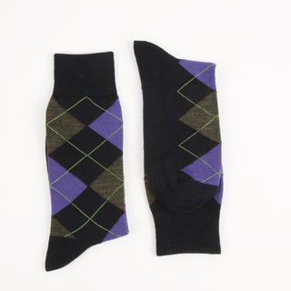 Pair of navy argyle socks with purple and green pattern on a white background