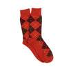 Orange argyle patterned socks on a white background