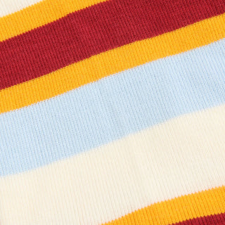 Close-up of multicolored striped fabric with red, orange, yellow, blue, and white stripes.