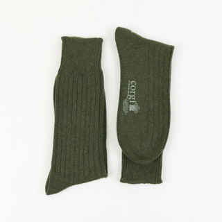 Pair of loden green cashmere ribbed socks on a white background