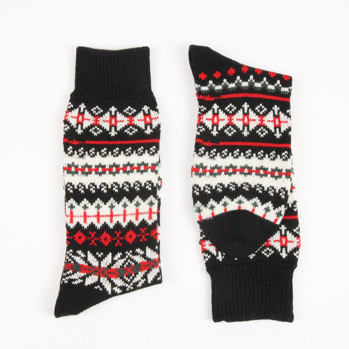 Pair of black socks with red and white pattern on a white background
