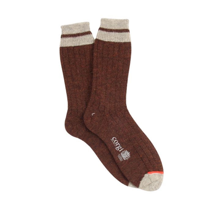 Pair of rust socks with a visible brand logo on a white background