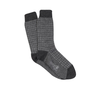 A pair of men's formal houndstooth merino wool socks in grey, showing the pattern and texture.
