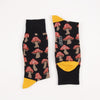 Pair of socks with mushroom pattern on a white background