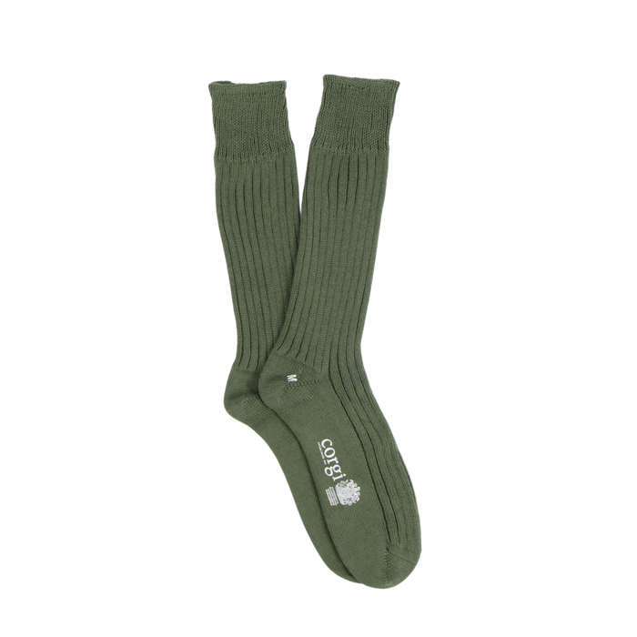 Green sock with a brand logo on a white background