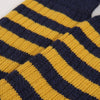 close up of the knitted sock stripe detail in yellow and navy