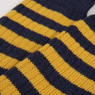 close up of the knitted sock stripe detail in yellow and navy
