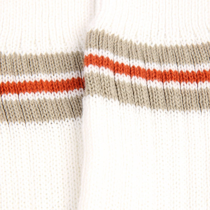 Close-up of a sock with horizontal stripes in beige, orange, and white on a white background
