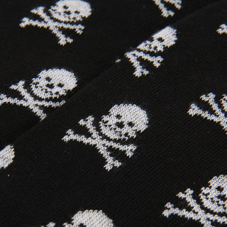 Black fabric with white skull and crossbones pattern