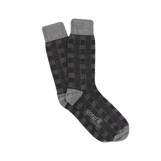 A pair of men's formal woven check cotton socks in black and white,