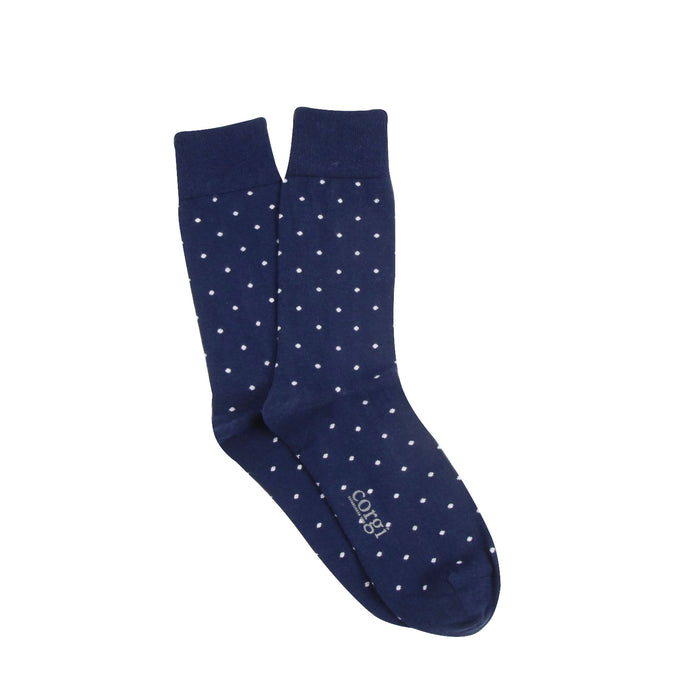 Navy blue socks with white polka dots on a white background