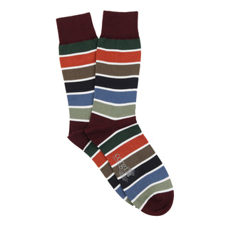 Colourful striped socks with a fine white stripe separating each colour on a white background