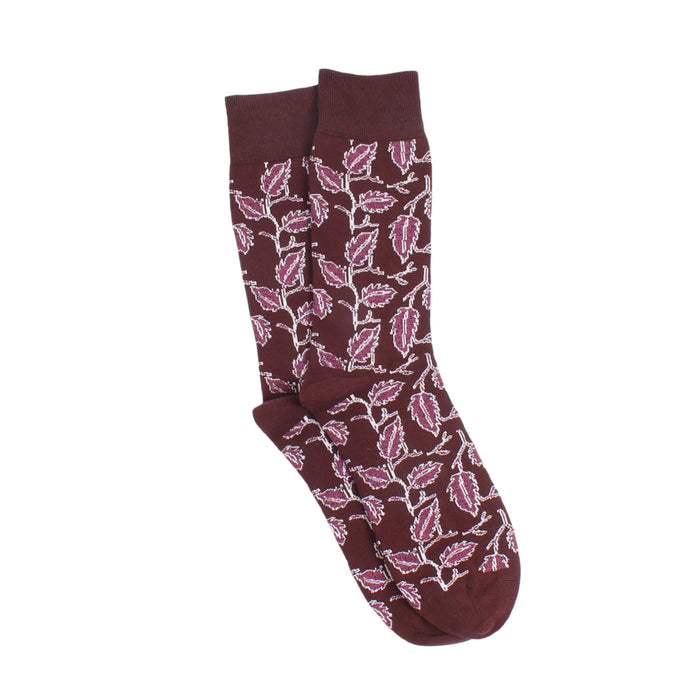 Maroon sock with pink leaf pattern on a white background