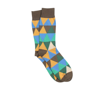 Colourful geometric-patterned sock photographed on a white background