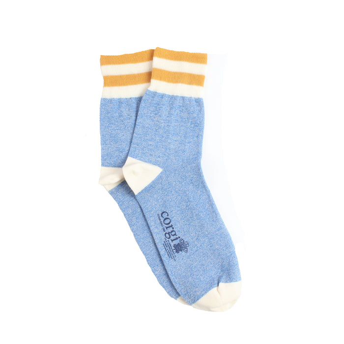 Blue sock with orange and white stripes on a white background