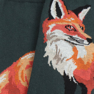 Intarsia fox design on a green fabric background