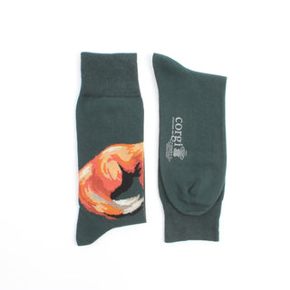Dark green socks with a fox design on one and text on the other, laid flat on a white background.