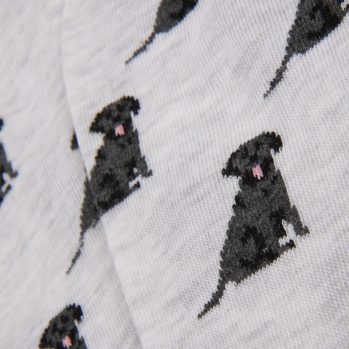 Pattern of black Labrador dogs on a grey background
