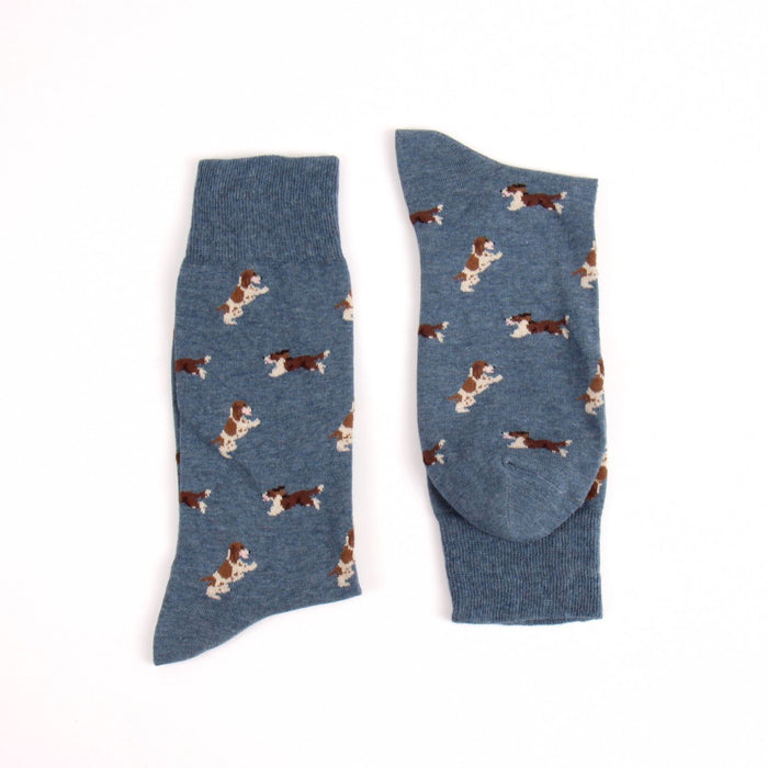 Blue socks with dog pattern on a white background