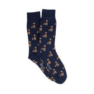 Navy blue socks with gold dog pattern on a white background