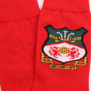 Red socks with a embroidered logo on a white background