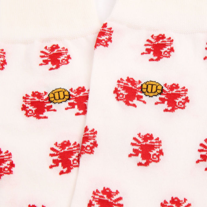 White socks with red dragon patterns and yellow football on a white background