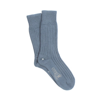 Pair of blue socks on a white background