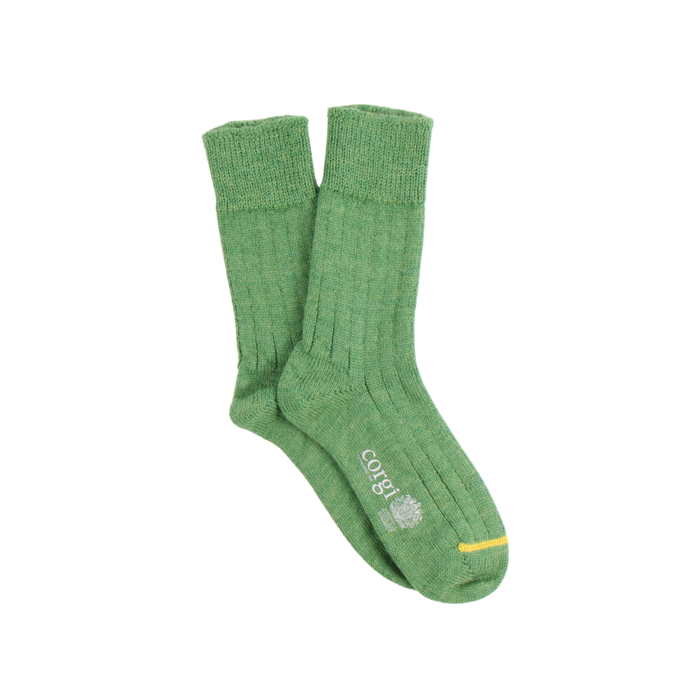 Green socks with a brand logo on a white background