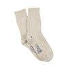Pair of beige socks with a brand logo on a white background