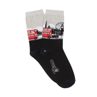 A pair of women's socks with a London theme, featuring a red double decker bus on a black and silver background.