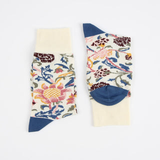 Pair of floral-patterned socks with blue accents on a white background