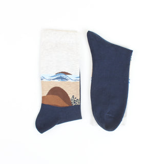 Navy blue sock with beach landscape design on a white background