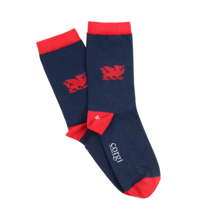 A pair of women's navy blue socks with red cuffs, heels, and toes, featuring the Welsh dragon design.