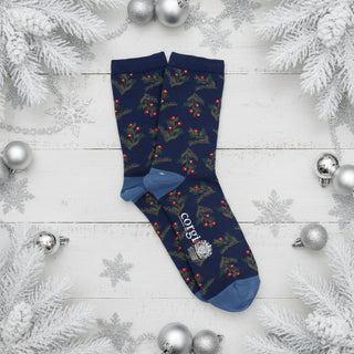 Navy blue socks with Christmas tree and berry pattern on a white background