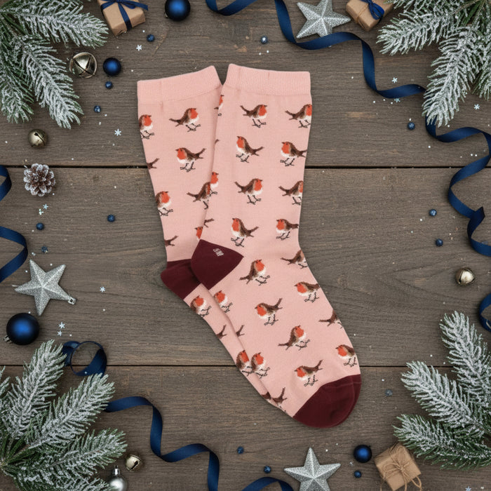 Pink socks with Robin pattern on a white background