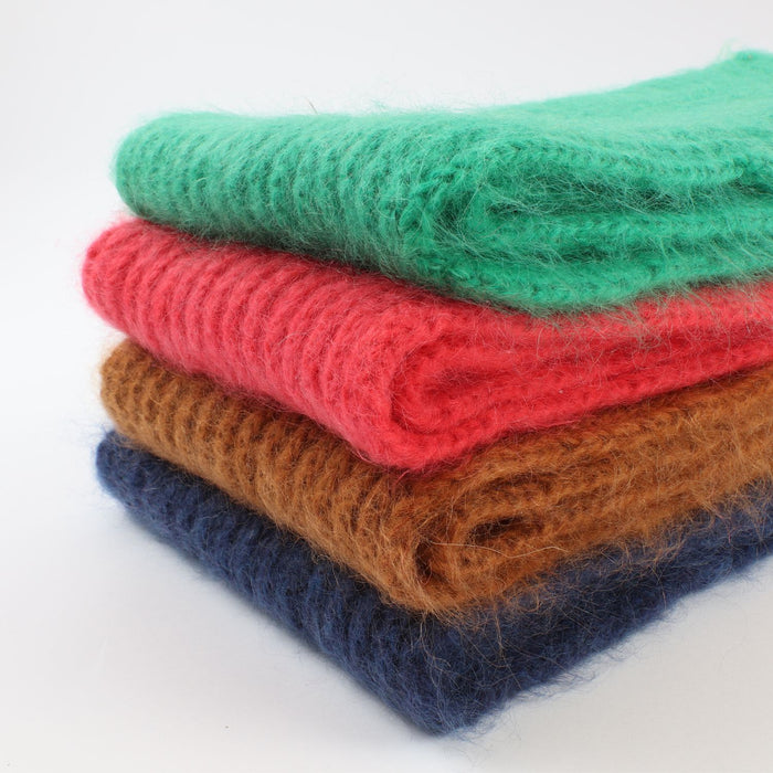 stack of jewel coloured mohair scarves