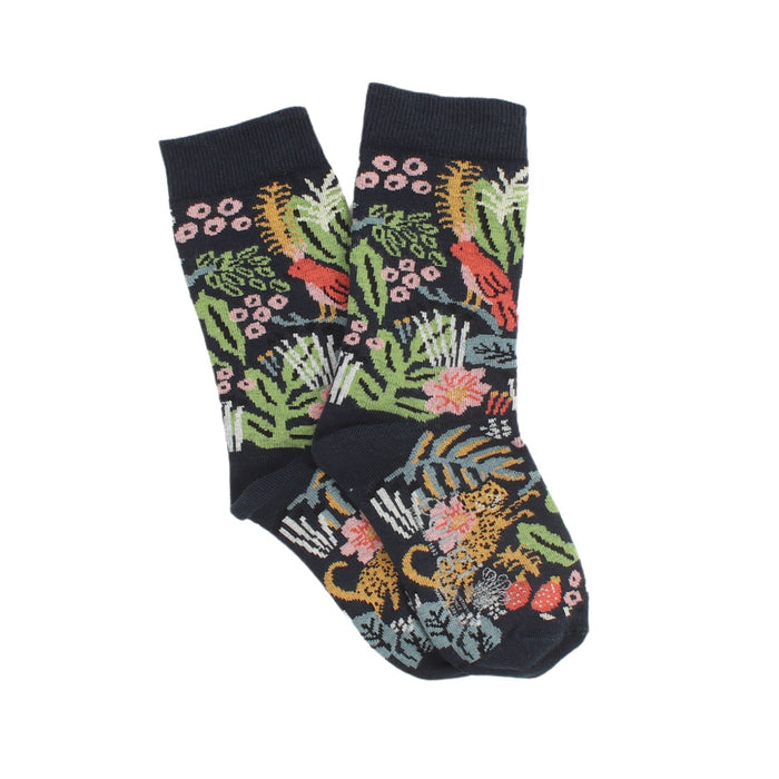 A pair of children's cotton socks with a jungle-themed pattern including colourful plants, flowers, and animals like leopards and birds on a navy background.