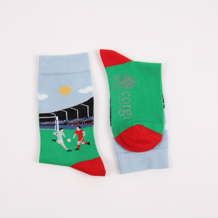 Two socks with football designs on a white background