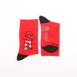 Red socks with a cartoon dragon design and 'Corgi' branding on a white background